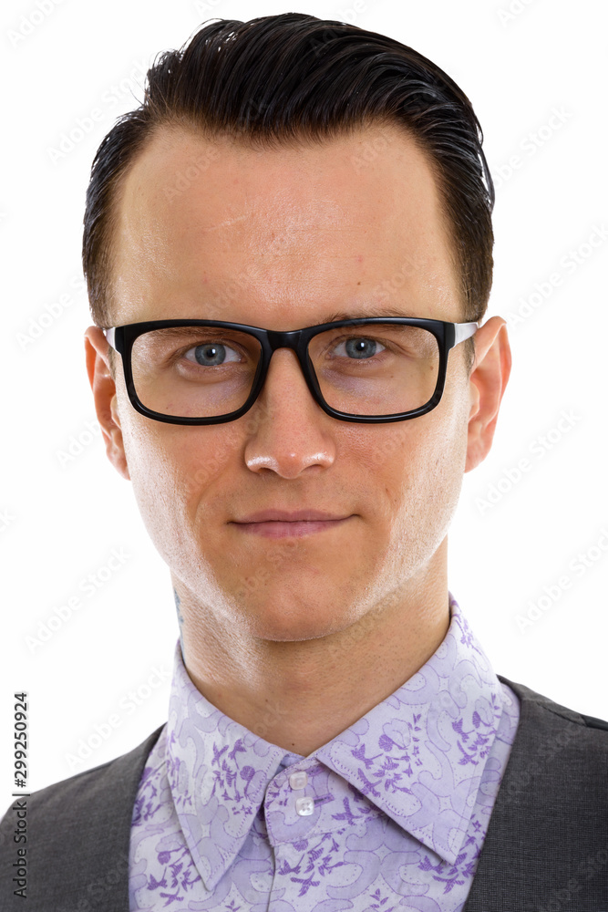 Face of young handsome businessman with eyeglasses in formal clothing