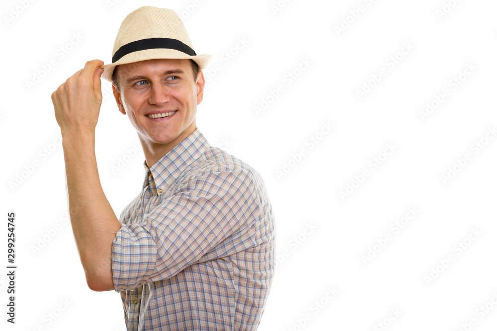 Portrait of young handsome tourist man wearing hat Portrait of young handsome tourist man wearing hat