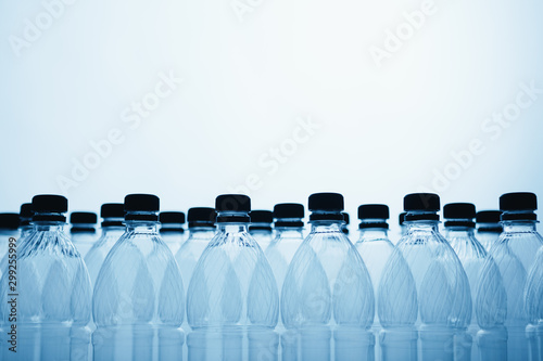 empty plastic bottle silhouettes on blue background