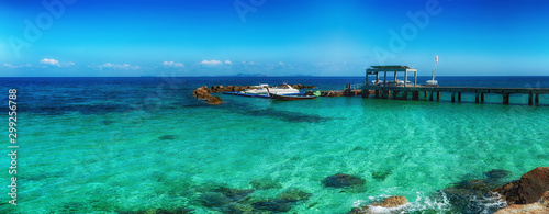Seascape panorama of little docks at tropical island. Thailand, Maiton island.
