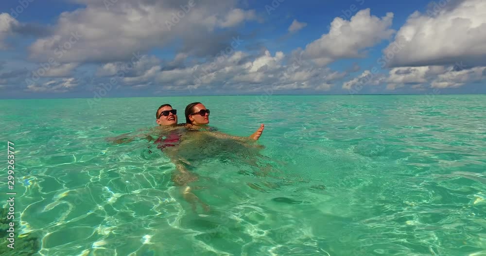 Couple Playing around in the sea Couple Playing around in the sea