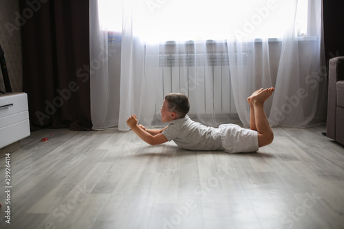 Photography Boy child 6 years old lying on floor in hysteria