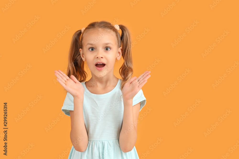 Surprised little girl on color background Stock Photo | Adobe Stock