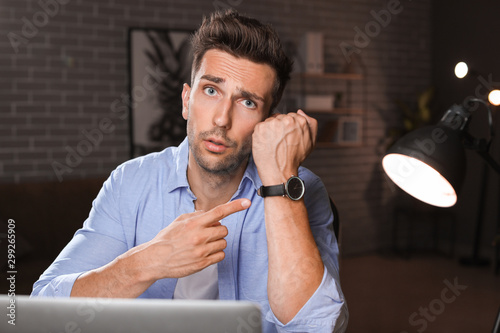 Tired man trying to meet de...
