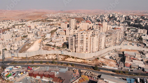 East Jerusalem Palestinian Refugge camp Surrounded By security Concerete Wall Drone Footage of Palestinian Refugge camp Shuafat With Security fence and Army Watch Tower photo