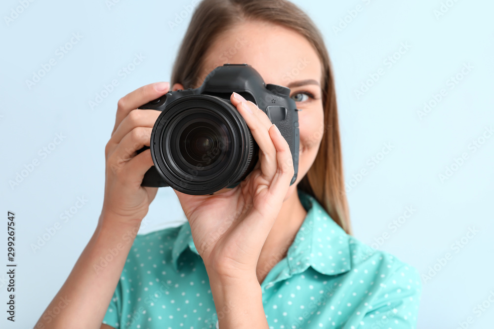 Female photographer on light background Female photographer on light background