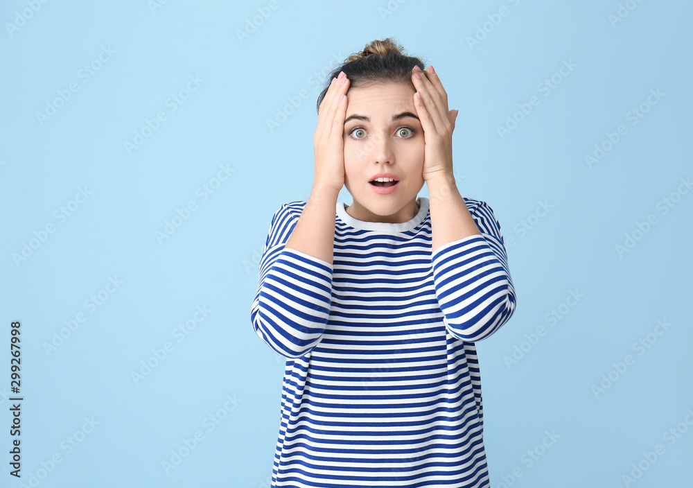 Surprised young woman on color background Surprised young woman on color background