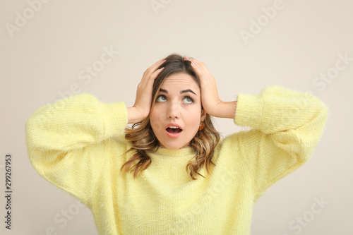 Surprised young woman on li...