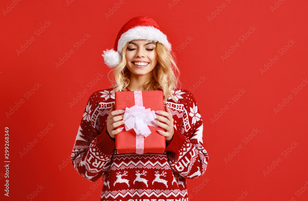 happy girl gets ready for christmas and packs gifts. happy girl gets ready for christmas and packs gifts.