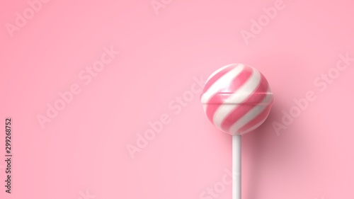 Striped fruit pink and white lollipop on stick on bright pink background with copy space photo