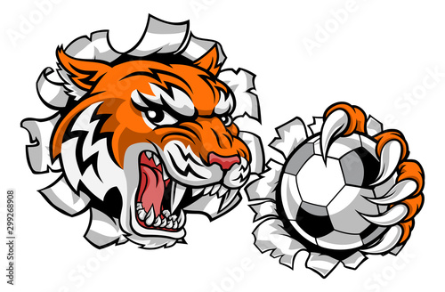 A tiger soccer football player cartoon animal sports mascot holding a ball in its claw