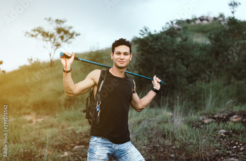 Handsome man holding trekking pole at nature,Travel at outdoor