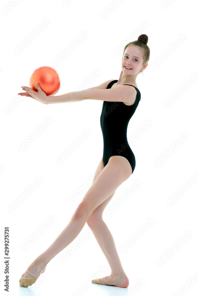 Girl gymnast performs exercises with the ball. Girl gymnast performs exercises with the ball.