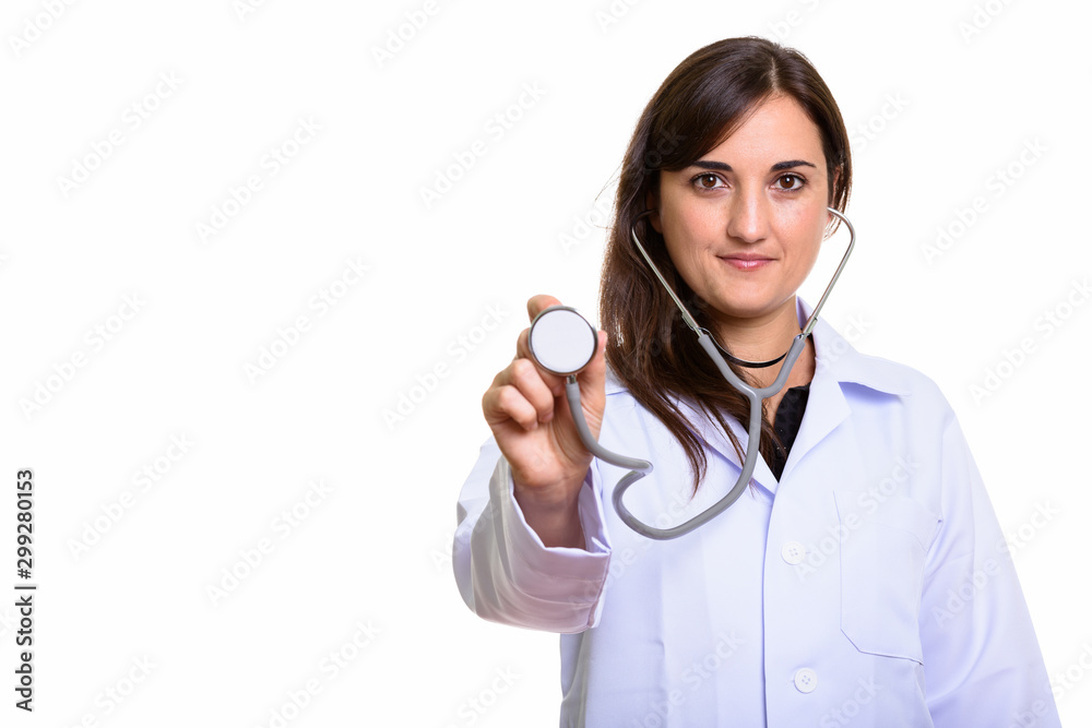 Studio shot of beautiful woman doctor using stethoscope Studio shot of beautiful woman doctor using stethoscope