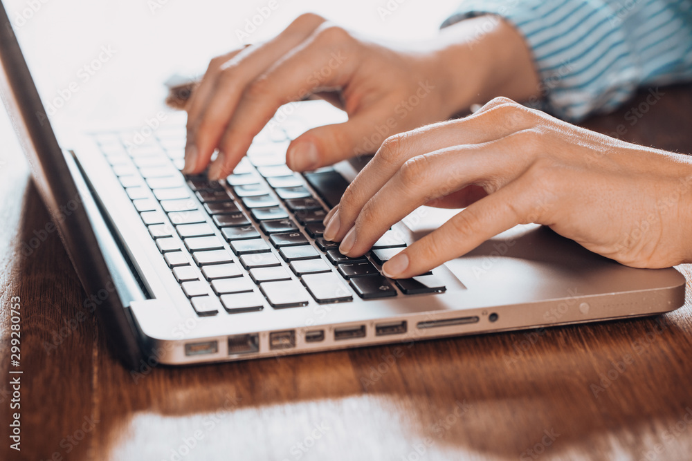 Woman working at home office hand on keyboard close up Woman working at home office hand on keyboard close up