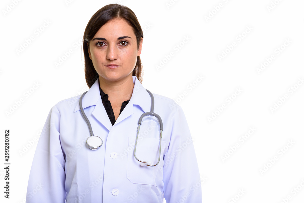 Studio shot of beautiful woman doctor looking at camera Studio shot of beautiful woman doctor looking at camera