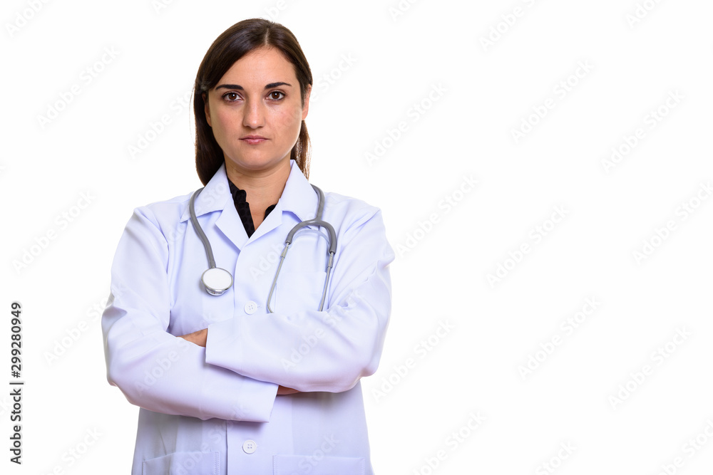 Studio shot of beautiful woman doctor with arms crossed Studio shot of beautiful woman doctor with arms crossed
