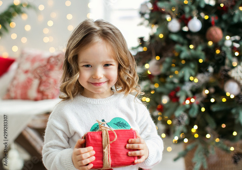 Little girl with Chritmas present.