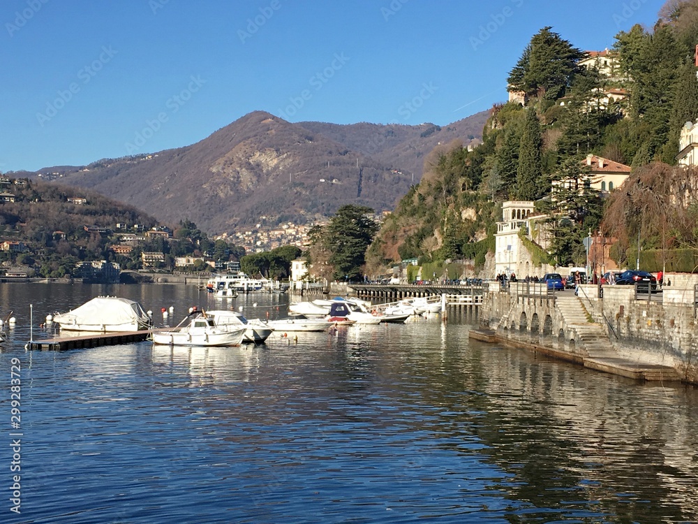 Walk on the lake Como and its colorful shores. Beautiful landscape. Italy. December 24, 2017