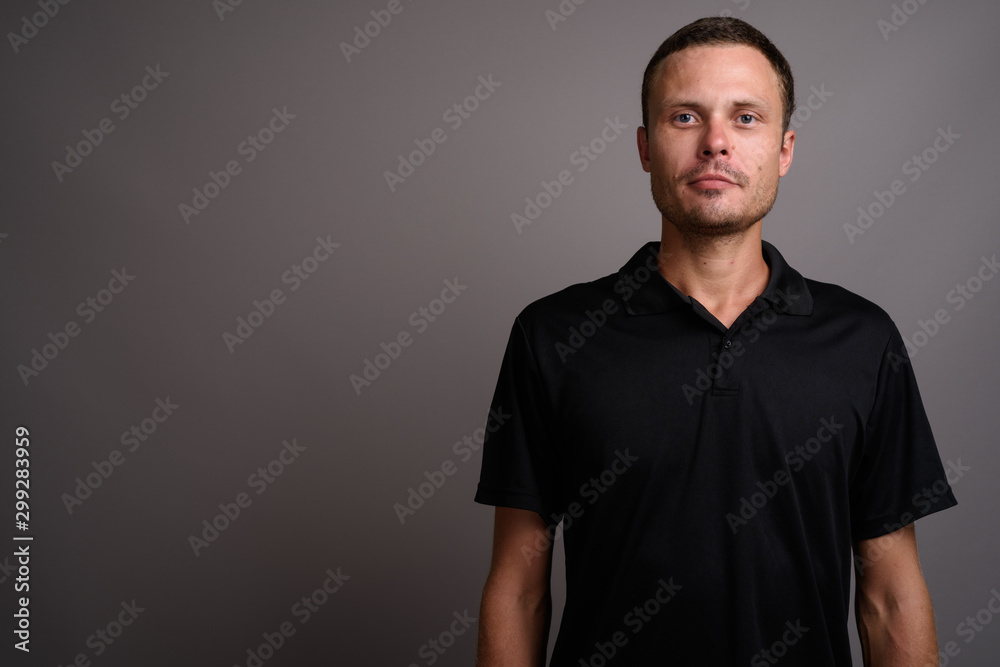 Portrait of handsome man against gray background Portrait of handsome man against gray background