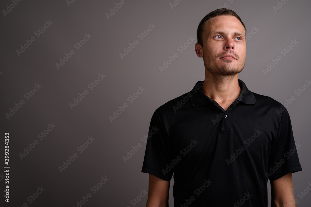 Portrait of handsome man against gray background Portrait of handsome man against gray background