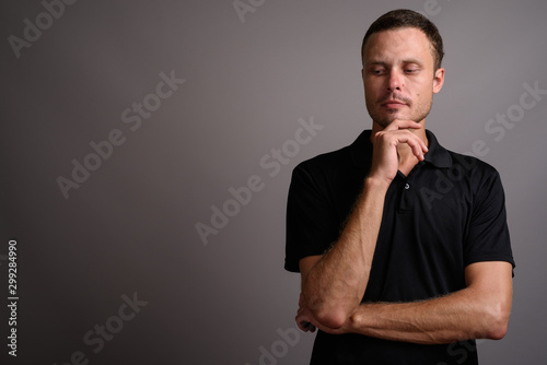 Portrait of handsome man against gray background