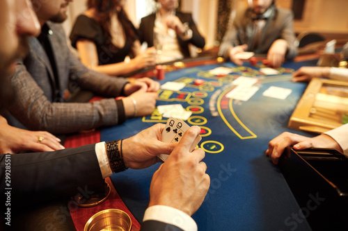 People play poker at the table in the casino. photo