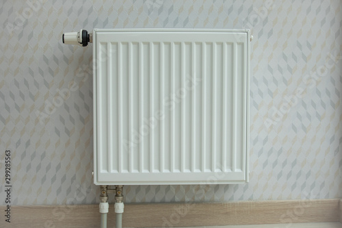 White radiator in an apartment. home heating photo
