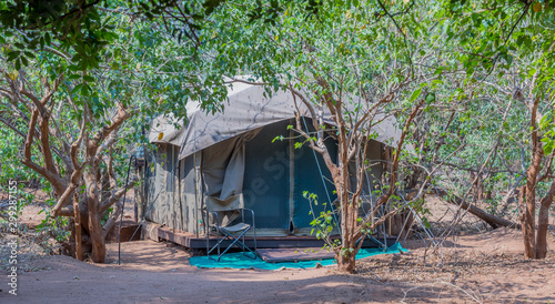 Camping in a tent in the African wilderness image with copy space in horizontal format