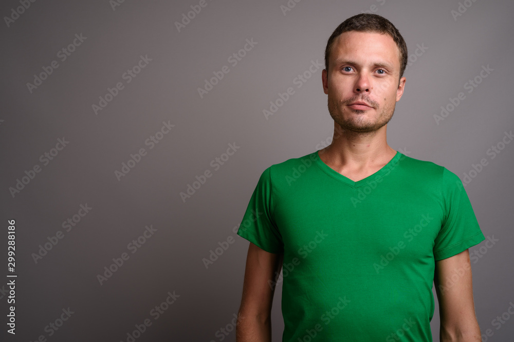 Portrait of handsome man against gray background Portrait of handsome man against gray background