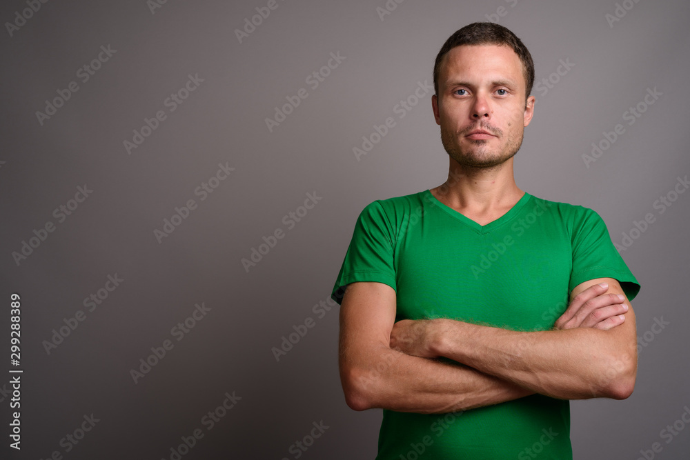 Portrait of handsome man against gray background Portrait of handsome man against gray background