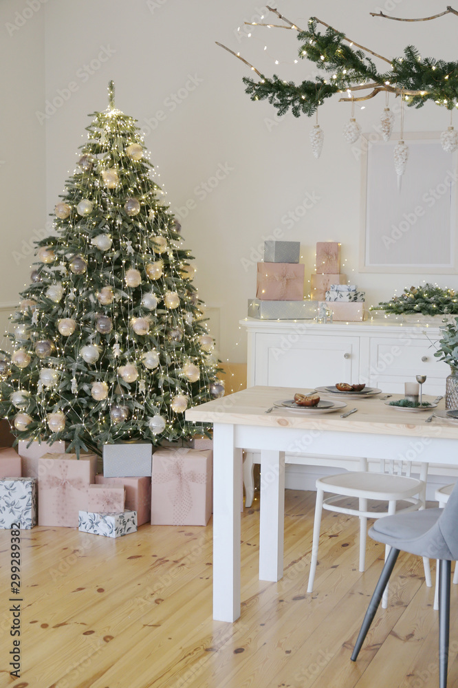 Room with a Christmas tree decorated for the new year