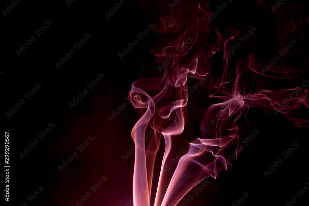 Obraz premium Red smoke on a black background.