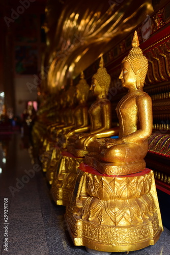 Golden statue of buddha in temple, Thailand