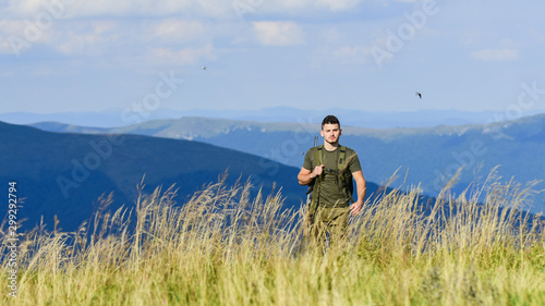 military style. male in camouflage. soldier in the field. polygon. army forces. sniper reach target mountain. man ready to fire. hunter hobby. muscular man hold weapon. never give up