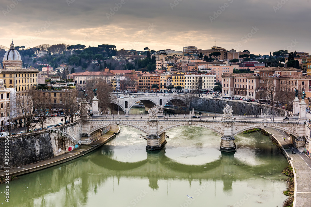 Riverfront view on Rome and stones bridges on Tiber river in Rome. Italy