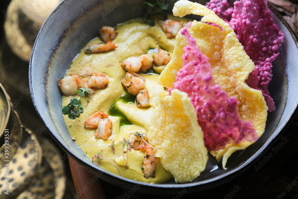 Homemade hummus with shrimps and rice chips Homemade hummus with shrimps and rice chips