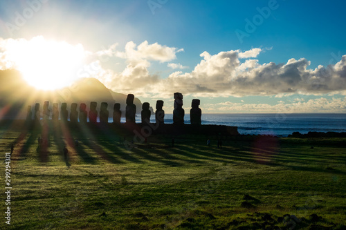 Huge sun ray lights behind Ahu Tongariki moais in Rapa Nui
