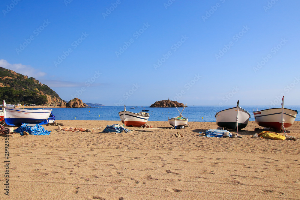 Costa Brava, fisher boats on the beach of the holiday destination Tossa de Mar, Catalonia - Spain Costa Brava, fisher boats on the beach of the holiday destination Tossa de Mar, Catalonia - Spain