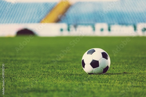 Close view of green football field with soccer ball © BillionPhotos.com