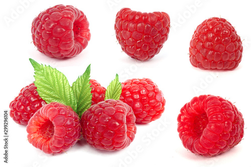 Ripe fresh natural raspberries with leaves isolated on white background