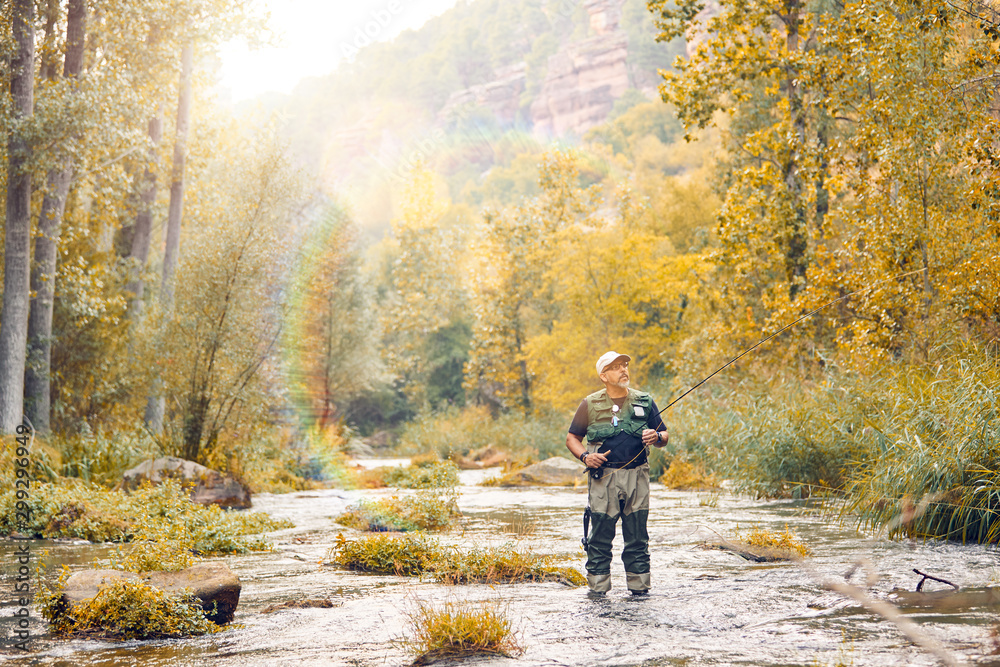 Man fishing a river Man fishing a river