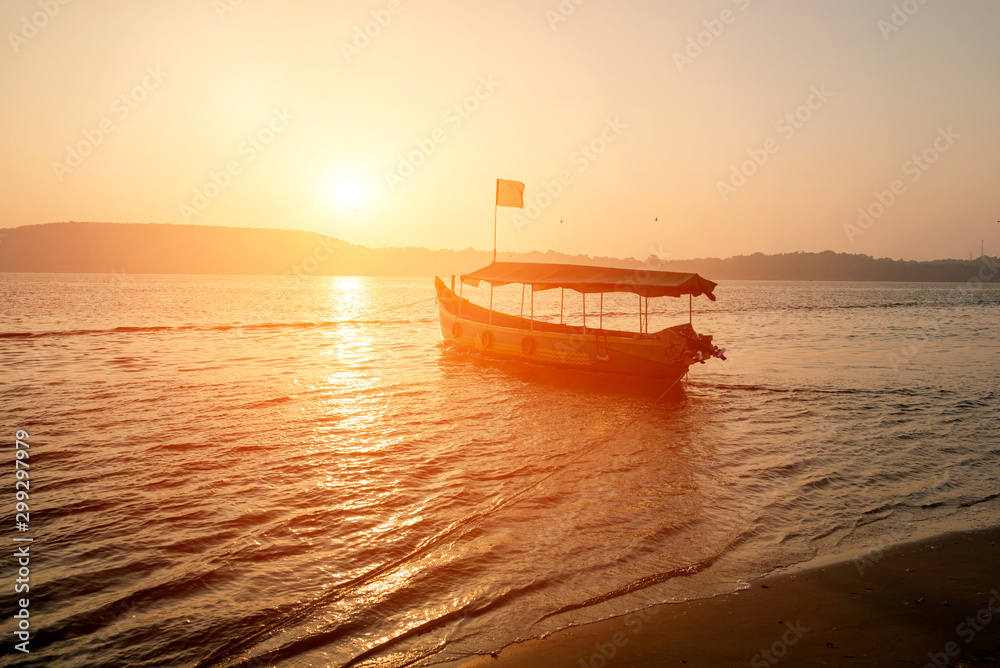 Old fishing boats on beach in Goa, India.