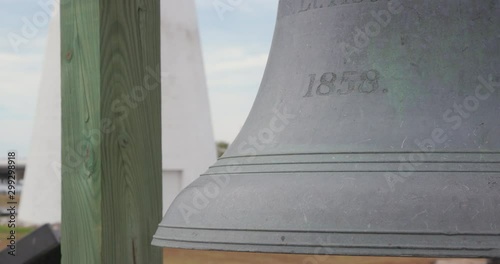 Large Bell Near Lighthouse and Keeper's Quarters photo