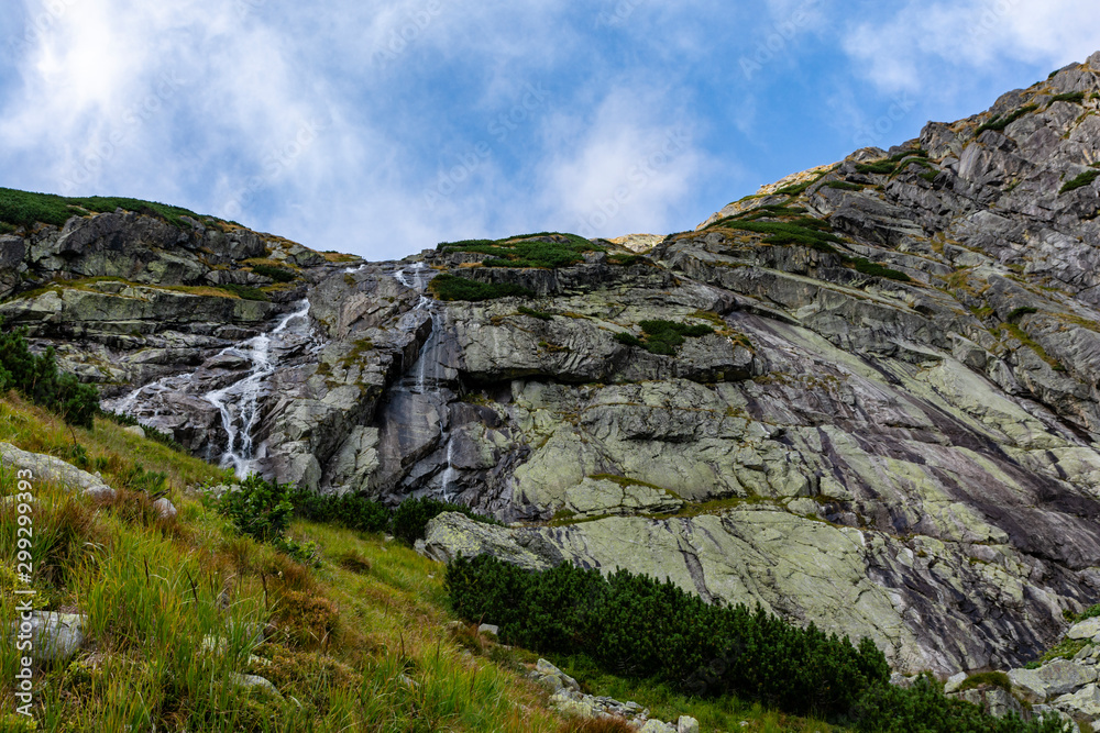 Zlota Siklawa (golden waterfall) - waterfall on the glacial threshold (Zlote Spady, Jazerna stena) in the Valley of Five Ponds Spiskie (Dolina Pieciu Stawow Spiskich, kotlina Piatich Spisskych plies).
