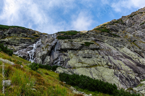 Zlota Siklawa (golden waterfall) - waterfall on the glacial threshold (Zlote Spady, Jazerna stena) in the Valley of Five Ponds Spiskie (Dolina Pieciu Stawow Spiskich, kotlina Piatich Spisskych plies). © gubernat