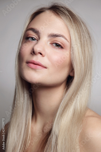 Portrait of young beautiful blonde girl with clean makeup