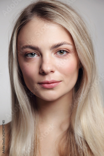 Portrait of young beautiful blonde girl with clean makeup