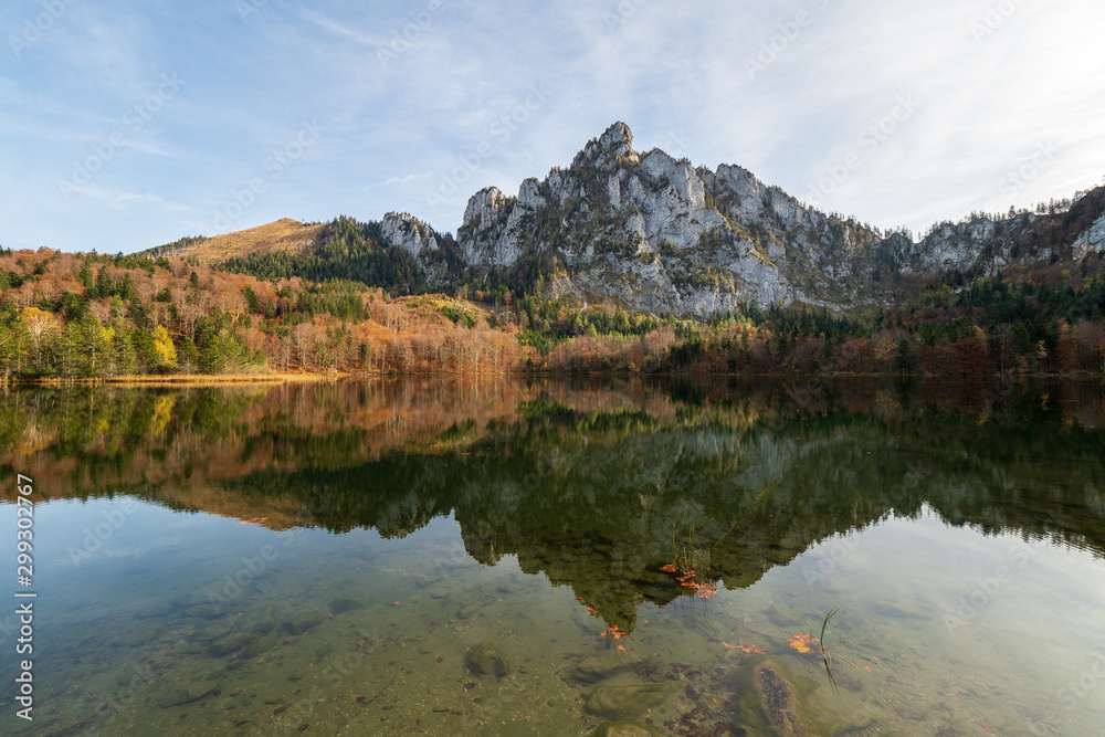 Stunning view of the Katzenstein reflecting in the crystal clear water of the Laudachsee near Gmunden, OÖ, Austria