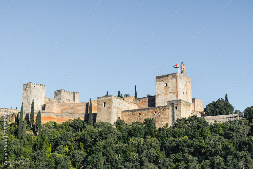 View of the Alhambra Palace from the Carvajales viewpoint. Blue sky for copy space or collage